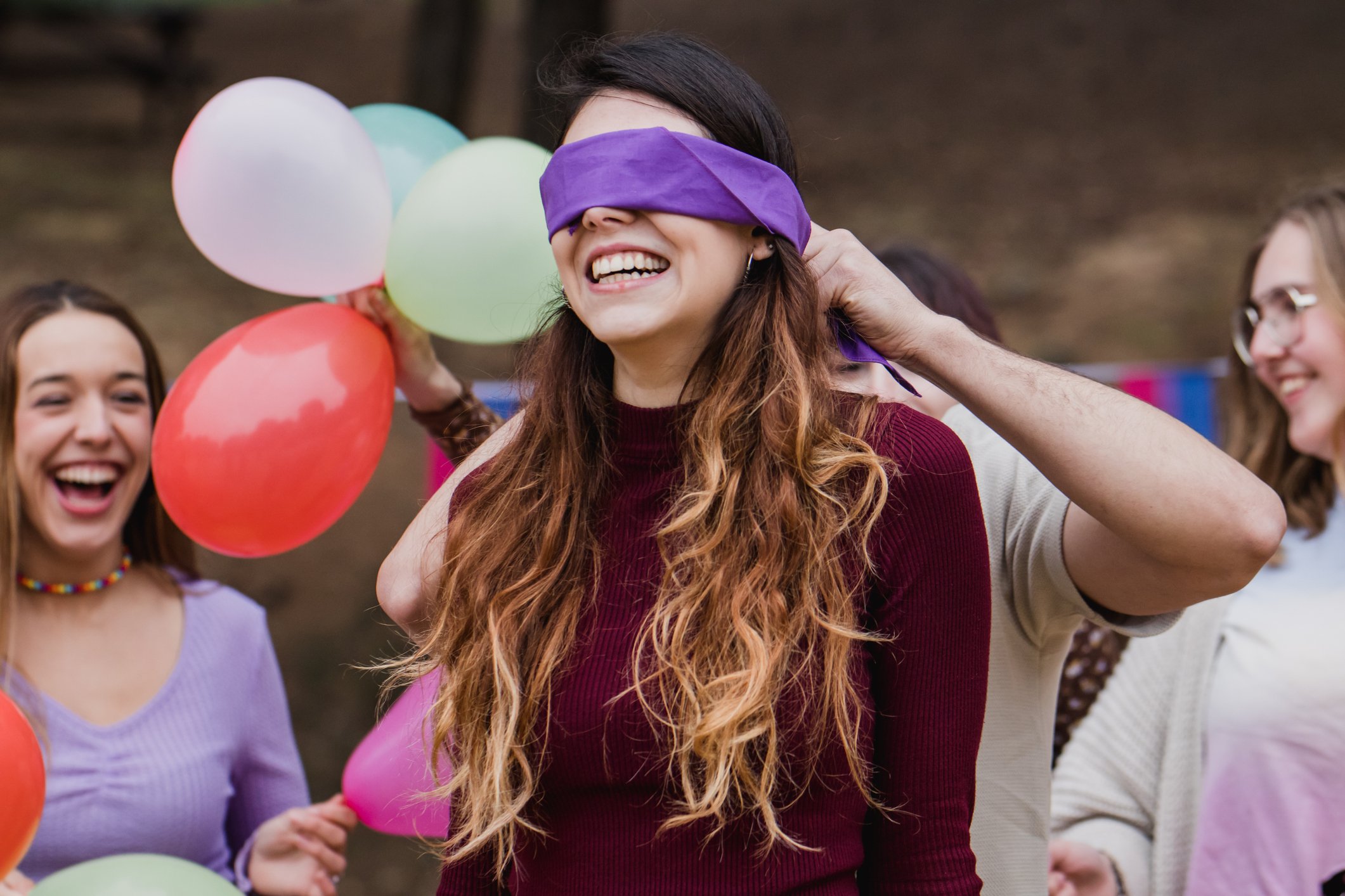 woman blindfolded at party 